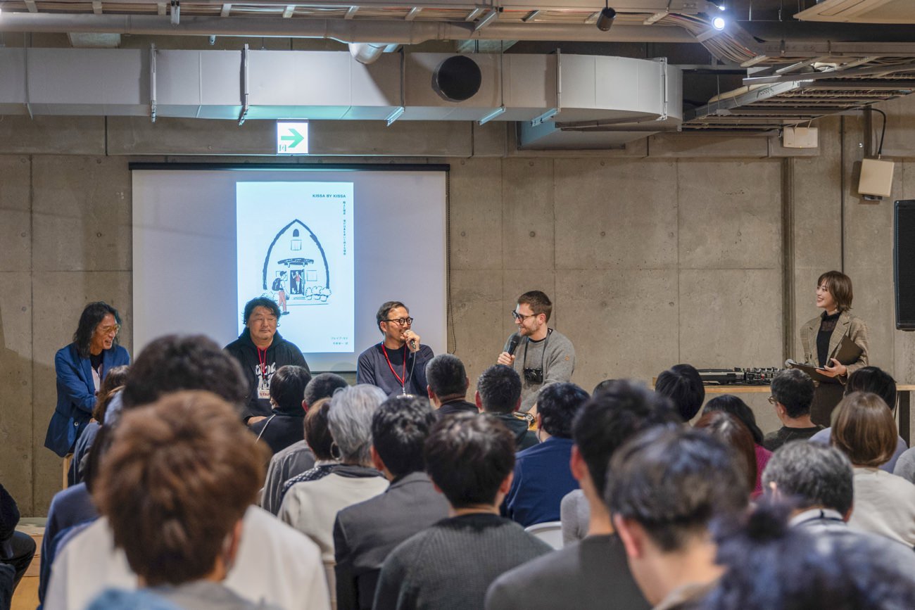 a scene from the launch event with craig and baba and hayasaka and imai on stage, mostly laughing