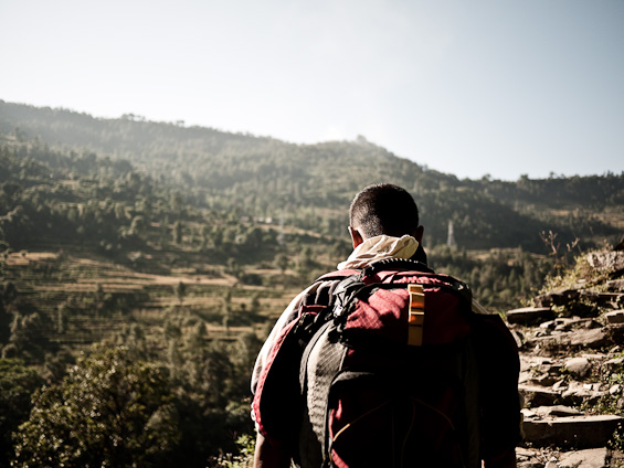 A man climbing in Nepal near Phedi