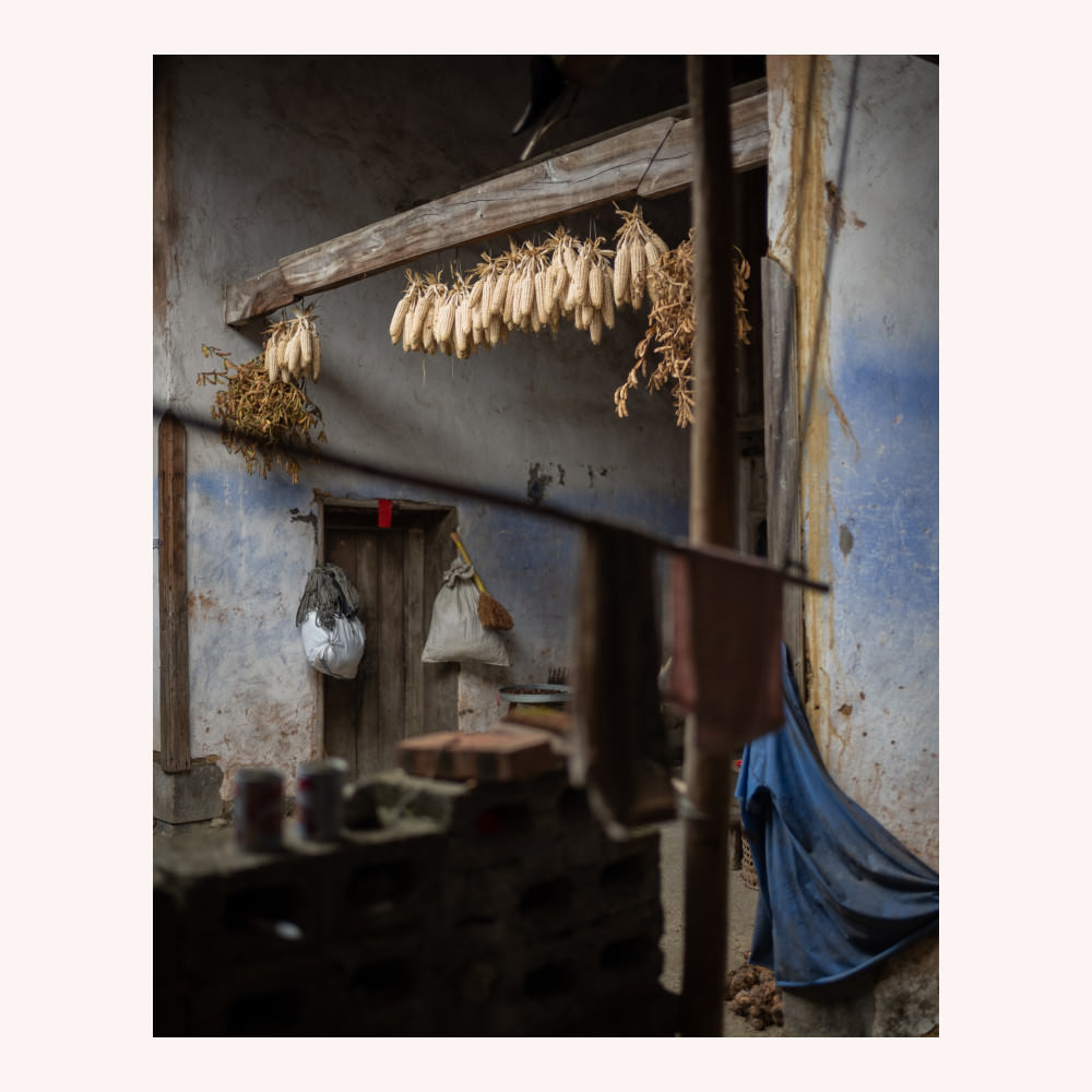 Hanging corn in a stone village