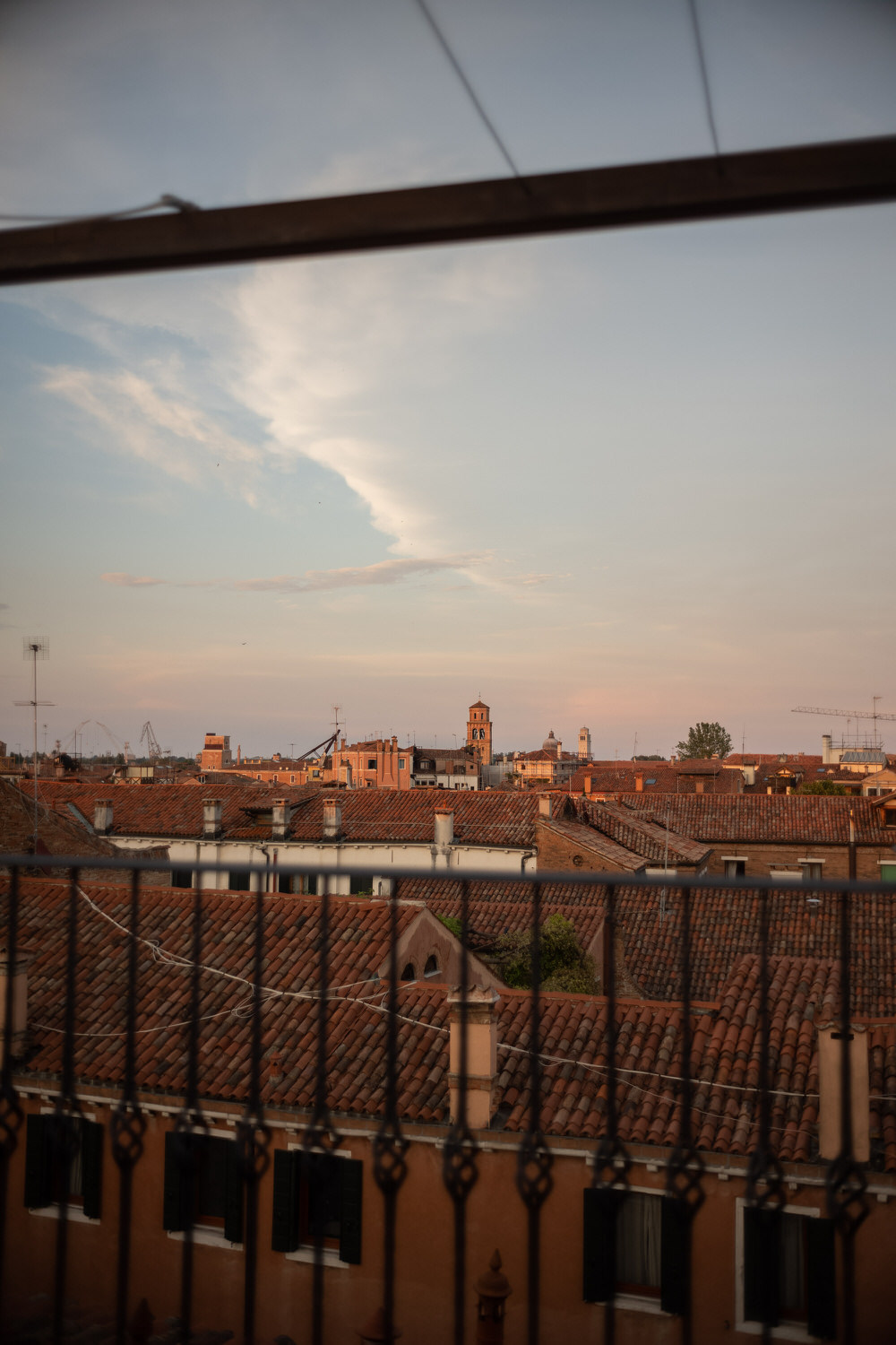 Venice rooftops cigarette in hand