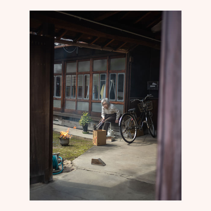 Woman burning weeds along the Nakasendo