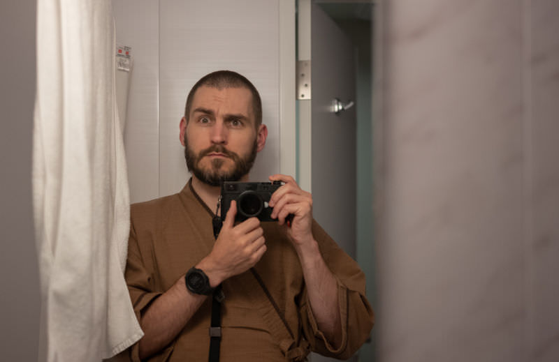 Craig in business hotel garb, unit bathroom